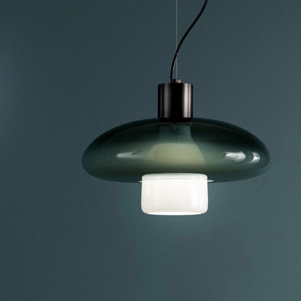 Chic green glass pendant light showcasing its elegant design in a contemporary living room setting.