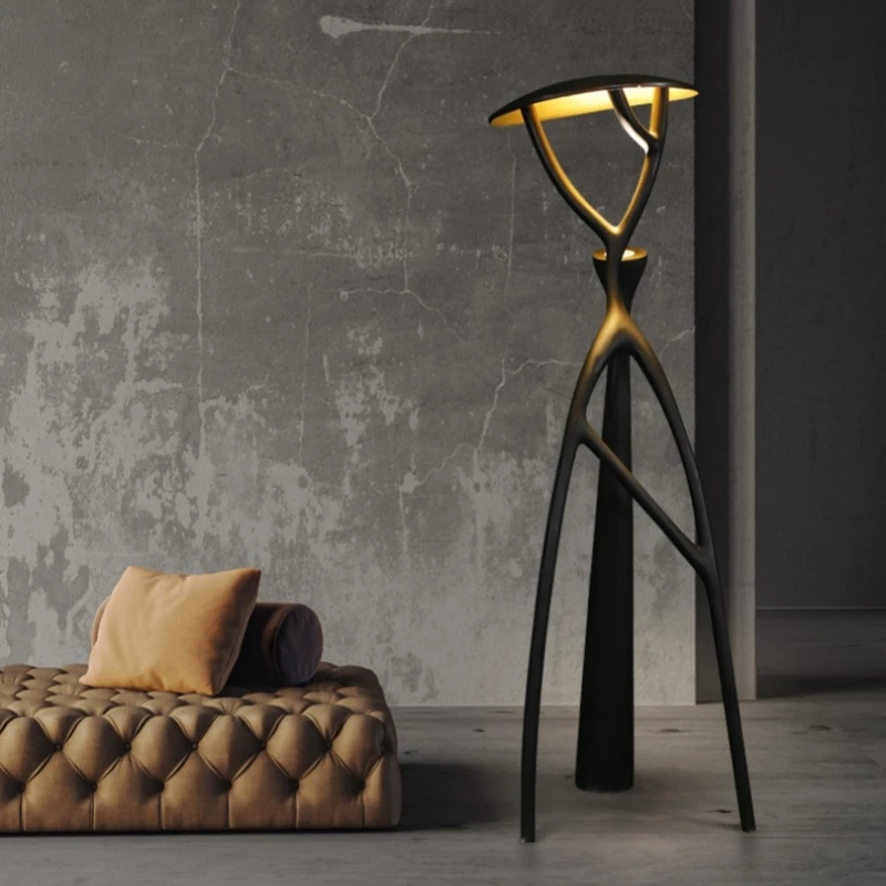 Elegant black LED floor lamp in a cozy living room setting, showcasing its stylish design.