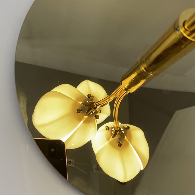Elegant ceramic magnolia flower lamp on a bedside table with soft lighting