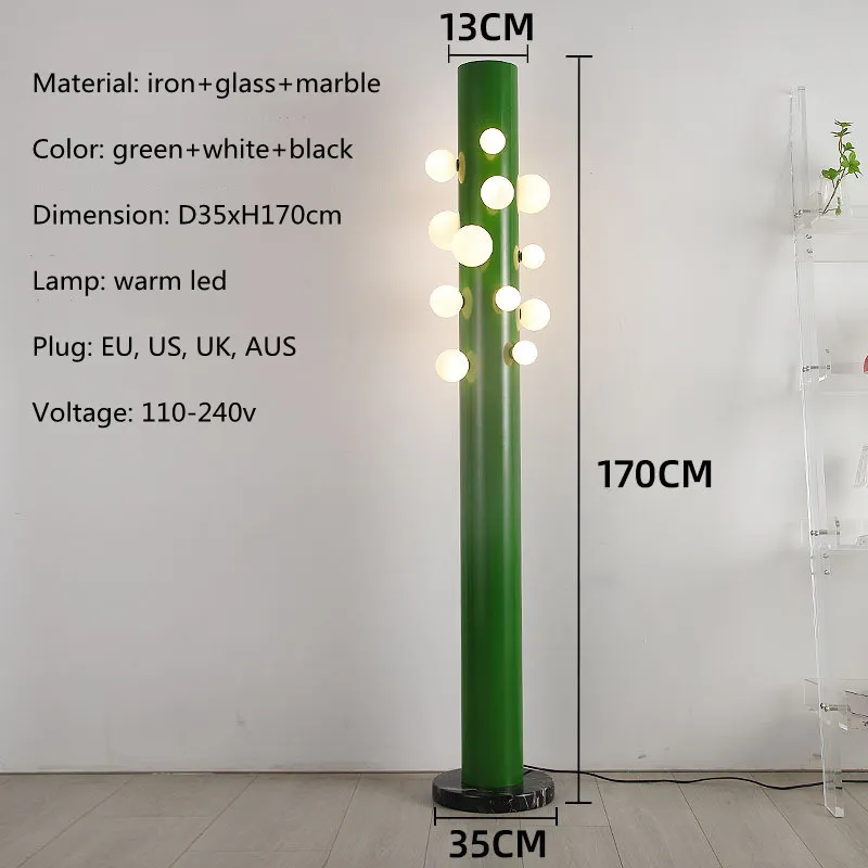 Close-up of the base and fluted vertical structure of the green cylinder glass floor lamp.