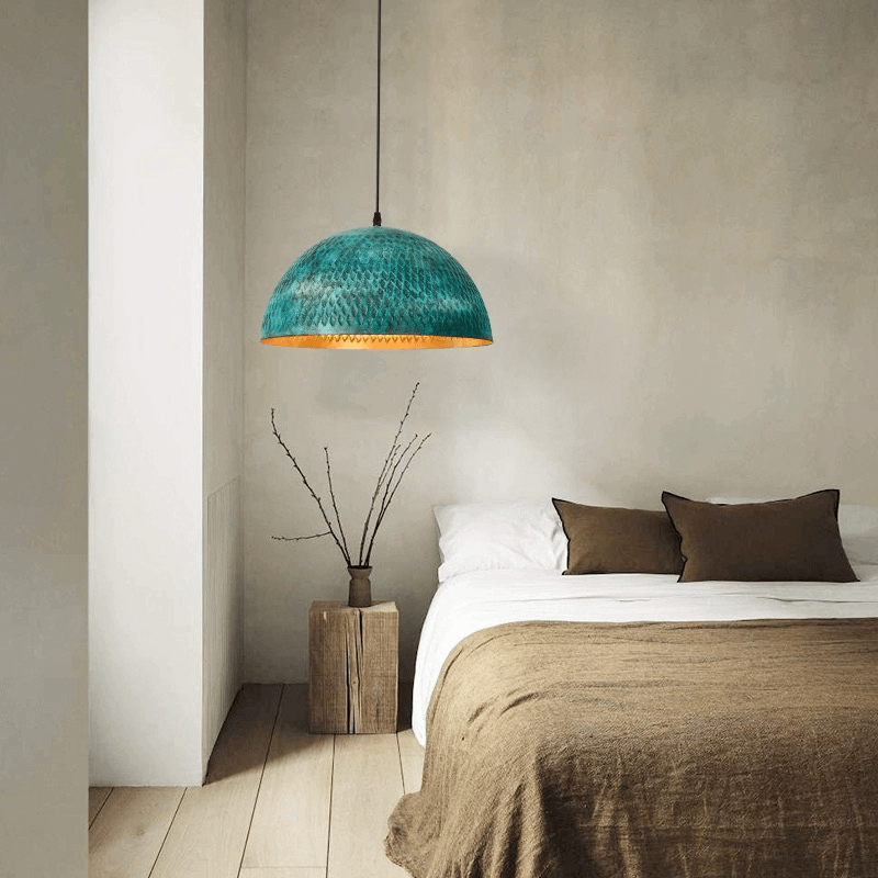 Urban Industrial Steel Pendant Light showcasing its vibrant green finish from a side angle.