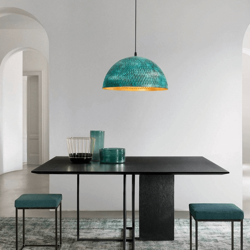 Urban Industrial Steel Pendant Light showcasing its vibrant green finish from a side angle.