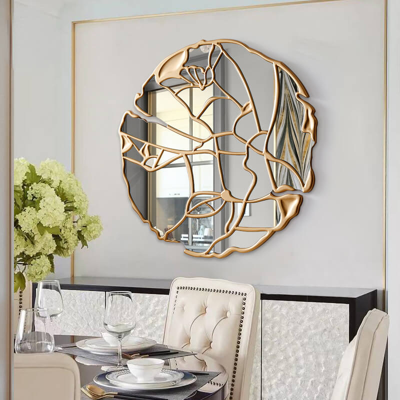 Elegant wall mirror in gold, perfect for entryway decor and adding visual interest.