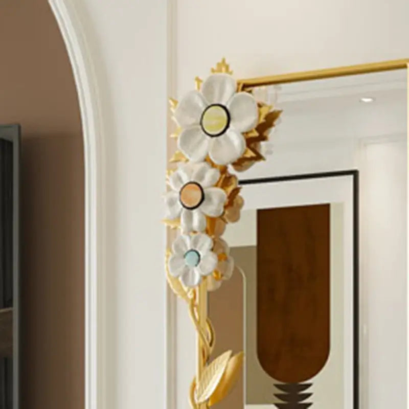 Full-length mirror leaning against a wall, reflecting a beautifully decorated space.