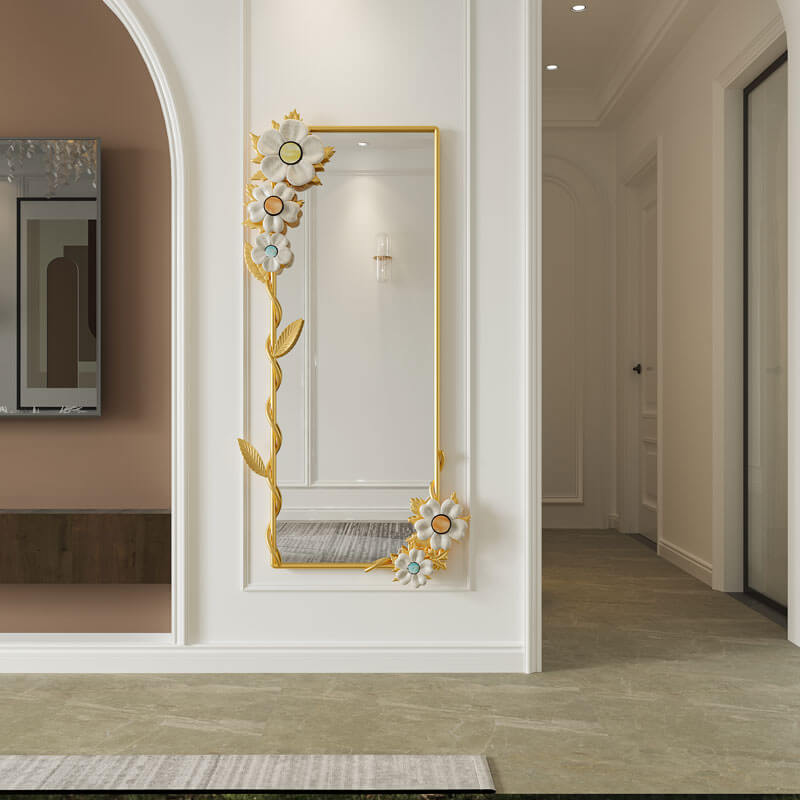 Full-length mirror leaning against a wall, reflecting a beautifully decorated space.