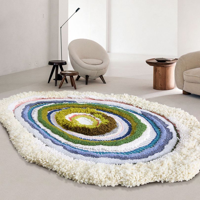 Close-up of a vintage handmade wool area rug showcasing its intricate design and texture.