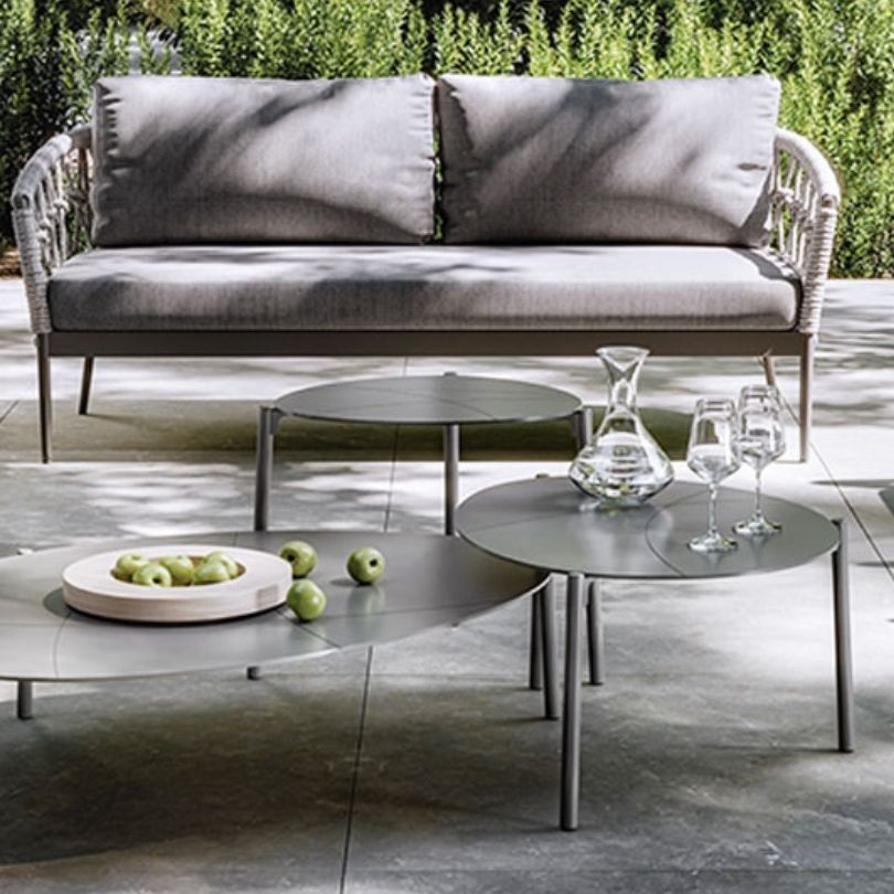 Italian-inspired modular woven rope sofa set in a garden setting.