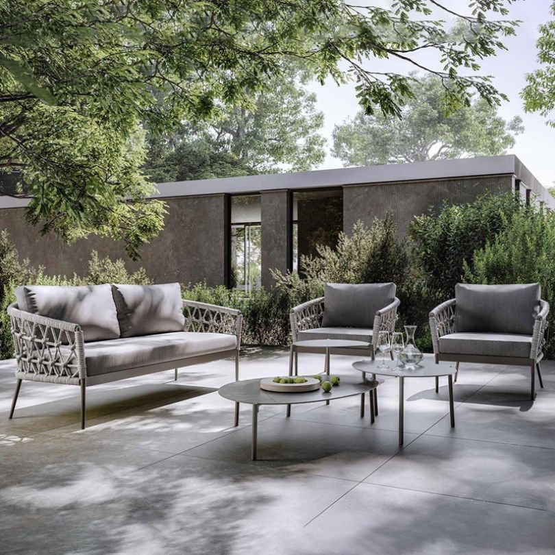 Italian-inspired modular woven rope sofa set in a garden setting.
