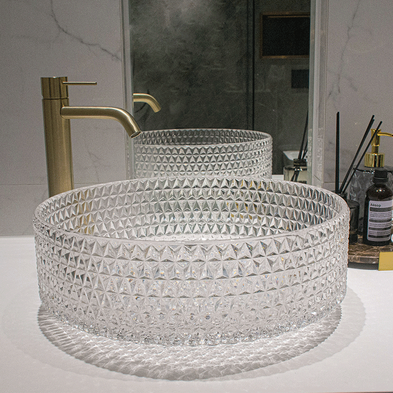 Elegant round glass vessel sink from the top, highlighting its sleek design and transparent surface.