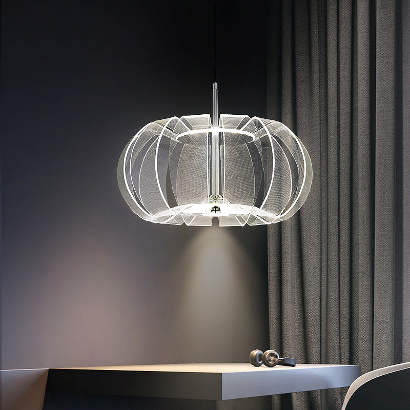 Acrylic LED pendant light showcasing its elegant design in a stylish living room setting.