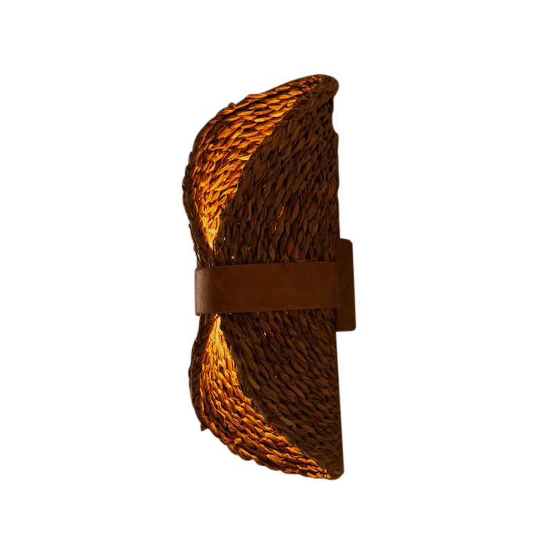 Close-up of the hemp rope detailing on the rattan wall lamp, highlighting its handcrafted quality.