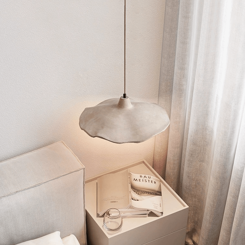 Japanese style yellow stone pendant lamp illuminating a café, creating a warm and inviting atmosphere.