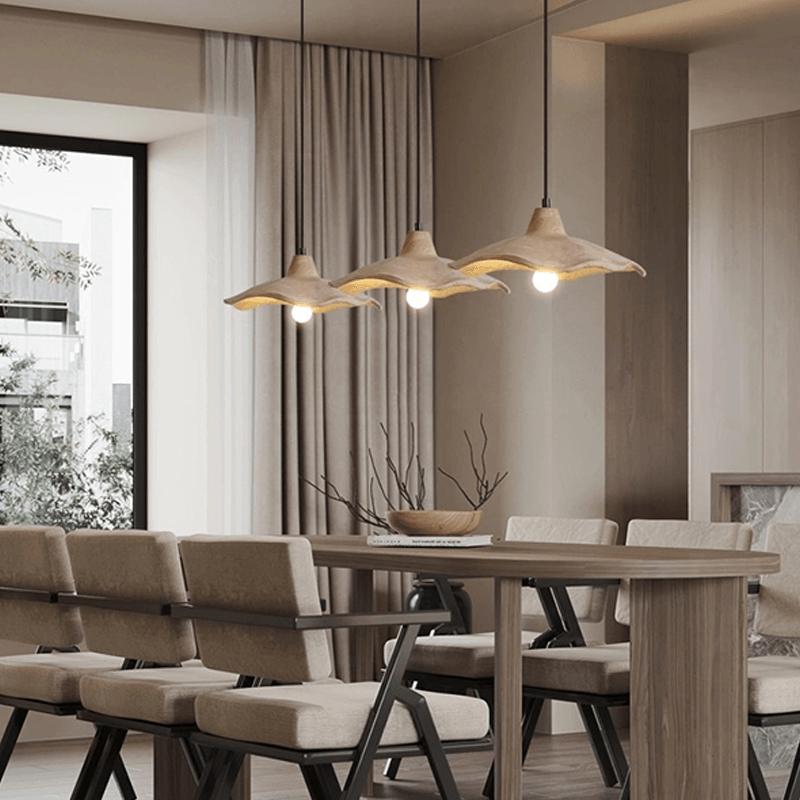 Japanese style yellow stone pendant lamp illuminating a café, creating a warm and inviting atmosphere.