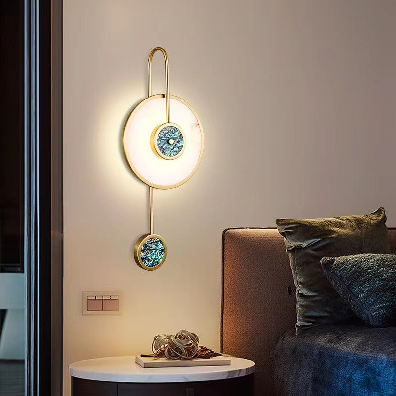 Elegant gold copper wall sconce showcasing its sophisticated design in a modern living room.