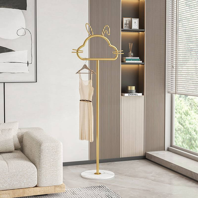 Charming kitty-shaped metal clothes rack showcasing its playful design and hooks for organization.
