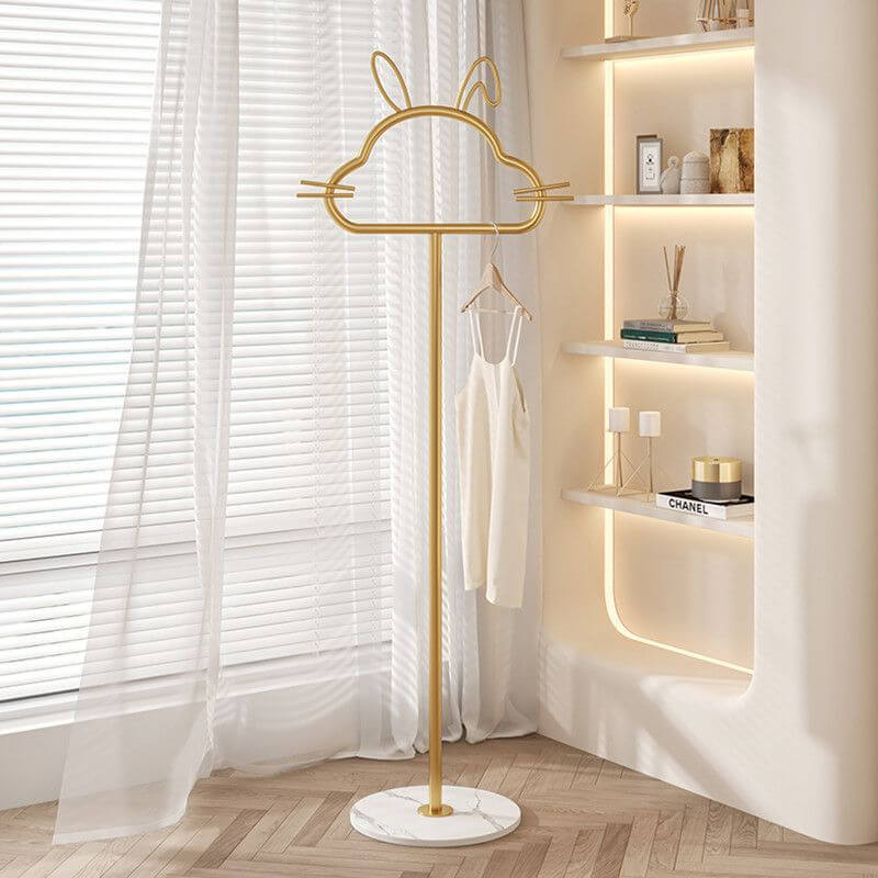 Charming kitty-shaped metal clothes rack showcasing its playful design and hooks for organization.