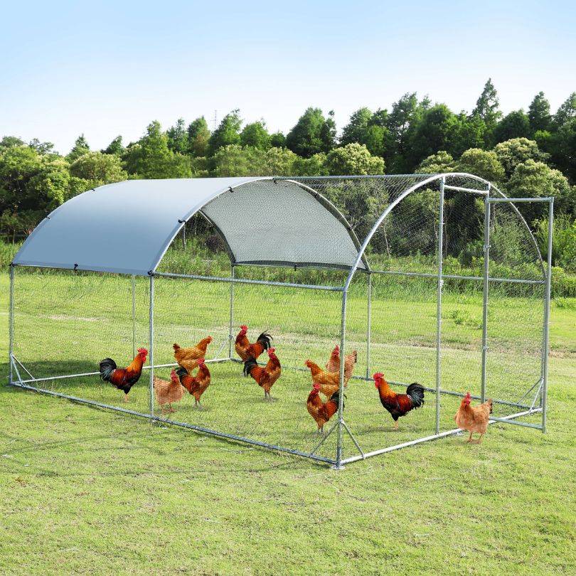 Large metal chicken coop with grey finish, designed for outdoor use.