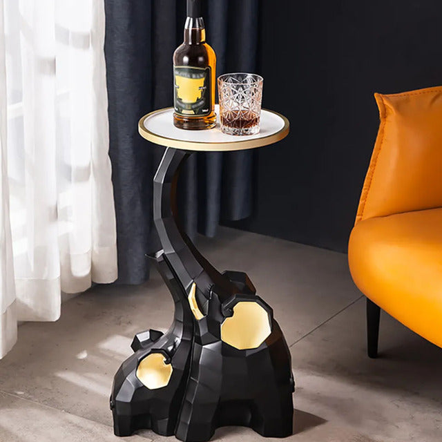 Side view of large resin elephant sculpture in a stylish living room.