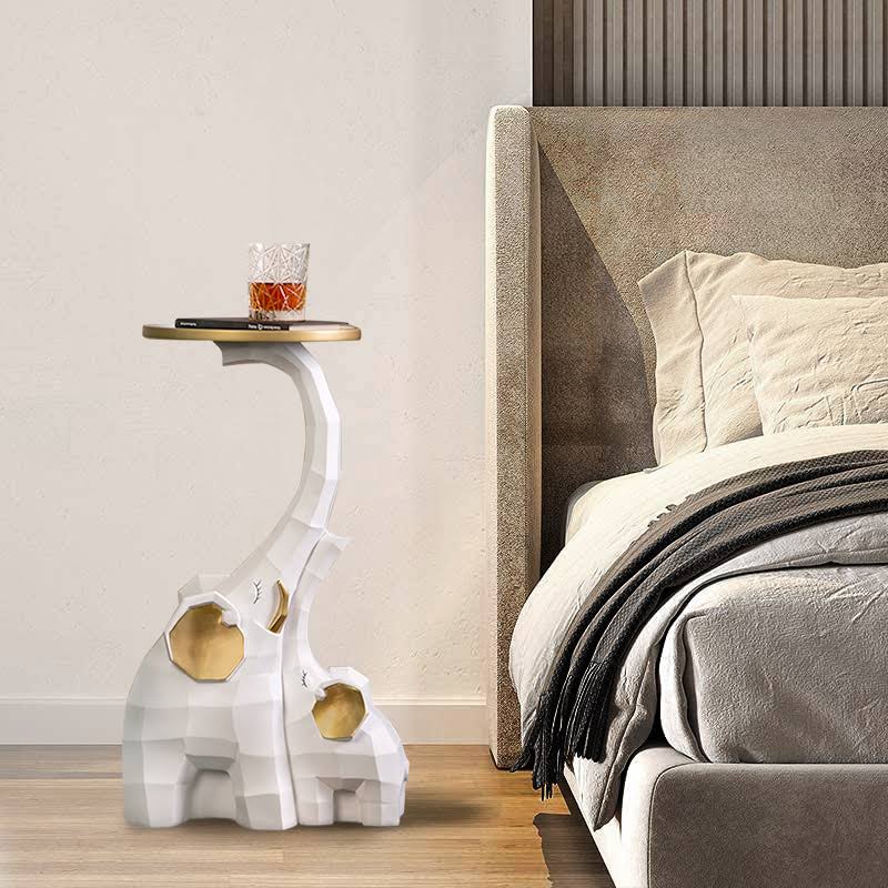 Elegant Nordic elephant sculpture with tray showcasing decorative plants.
