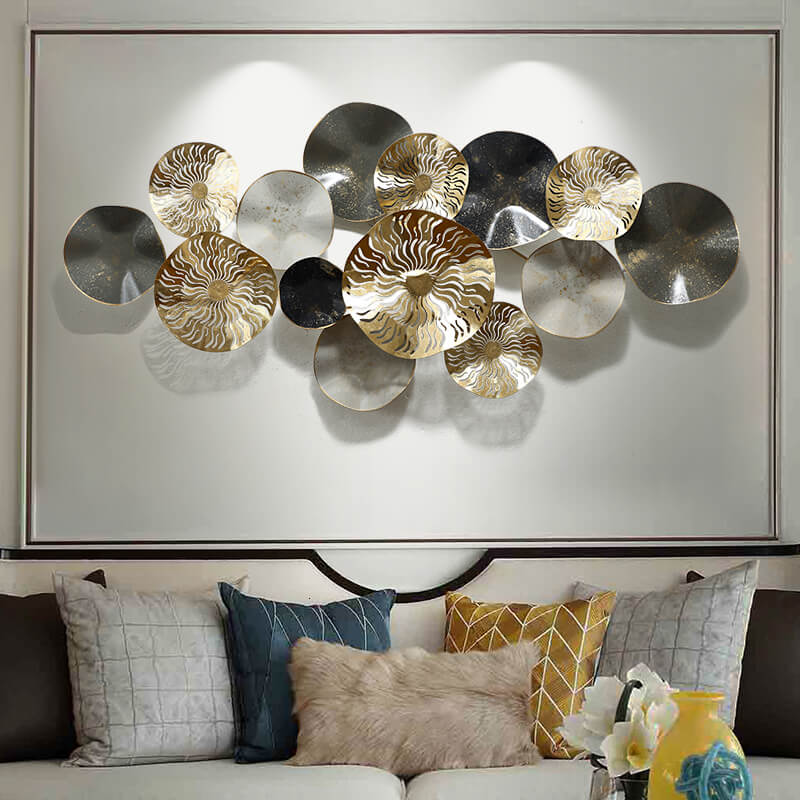 Gilded 3D metal wall art showcasing a minimalist design in a bright living room corner.
