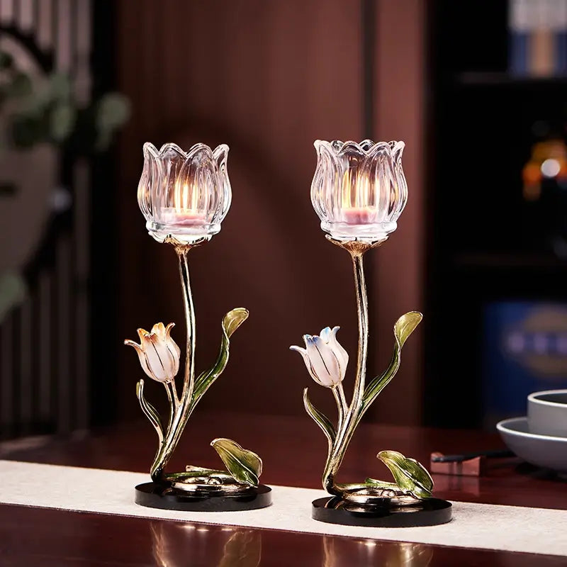 Elegant enamel tulip candle holder showcasing soft light in a dining setting.