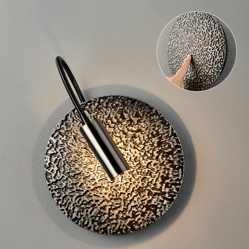 Luxury black wall lamp displayed in a cozy cafe setting, enhancing the elegant atmosphere.