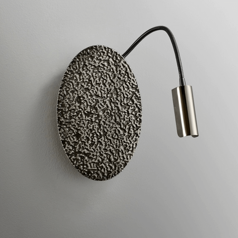Flush mount black wall lamp for office, highlighting its sleek finish and ambient lighting effect.