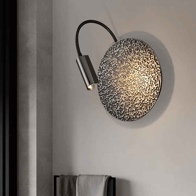 Luxury black wall lamp displayed in a cozy cafe setting, enhancing the elegant atmosphere.