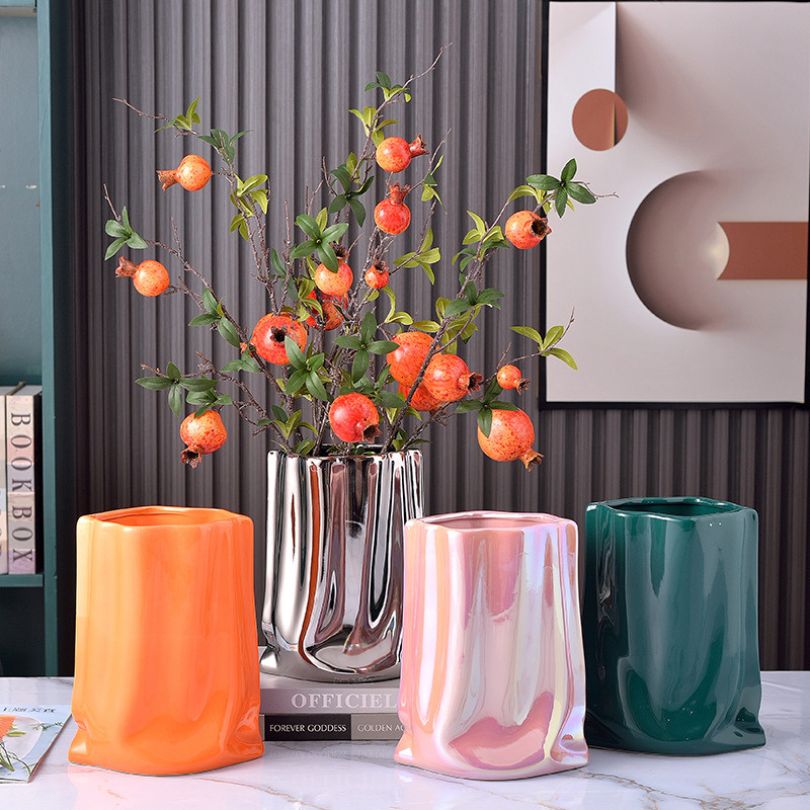Chic modern textured ceramic vase in a stylish living room setting.