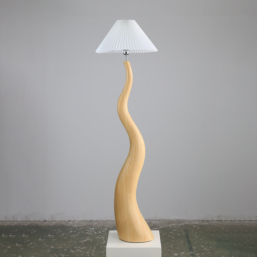 Close-up of the handcrafted resin body of the floor lamp, highlighting its unique organic shapes.
