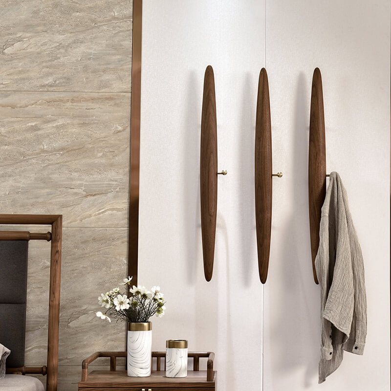 Front view of the Artisan Modern Wall-Mounted Coat Rack showcasing its sleek design and hooks.