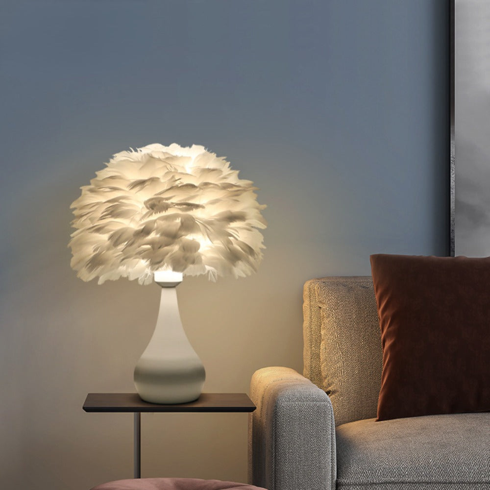 Feather lamp displayed in a bedroom, adding warmth and elegance to the space.