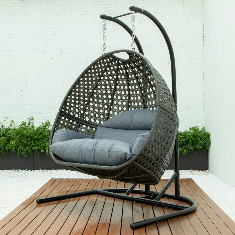 Couple enjoying time together in the outdoor swing chair