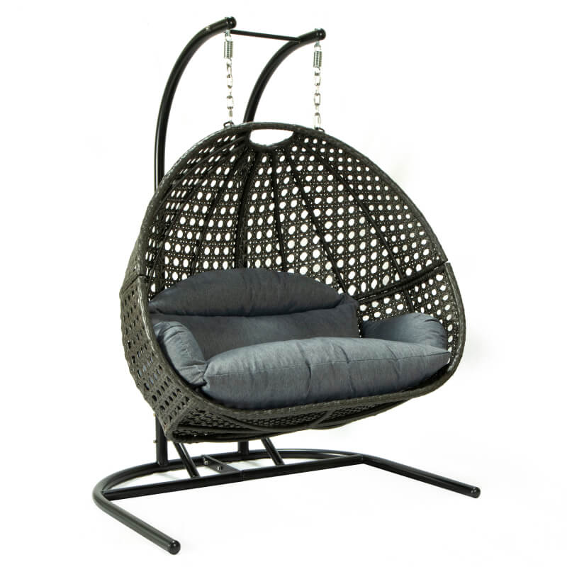 Couple enjoying time together in the outdoor swing chair