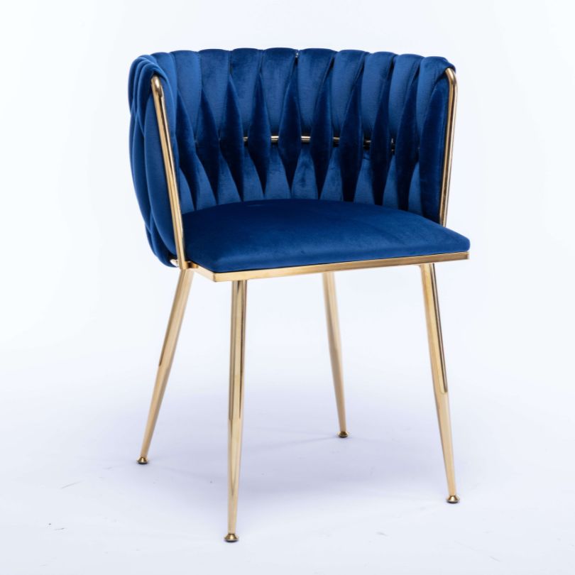 Elegant blue velvet dining chair featuring gold legs from the side view, perfect for dining rooms.