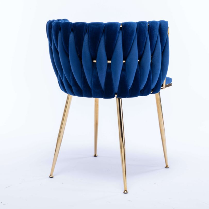 Elegant blue velvet dining chair featuring gold legs from the side view, perfect for dining rooms.