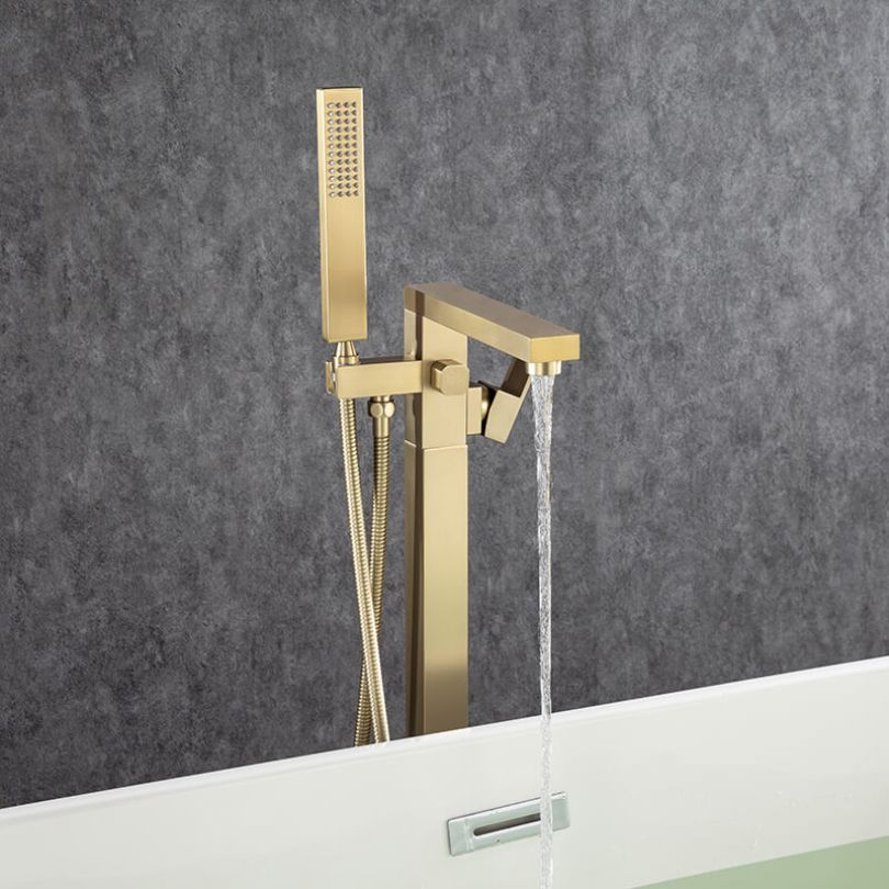 Hand shower feature of the gold freestanding faucet showcasing its usability.