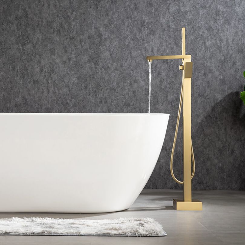 Hand shower feature of the gold freestanding faucet showcasing its usability.