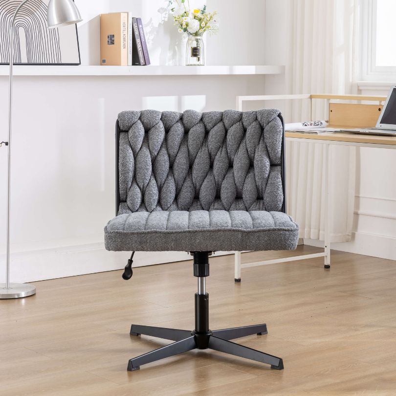 Premium grey armless swivel office chair showcasing its elegant design and comfort features.