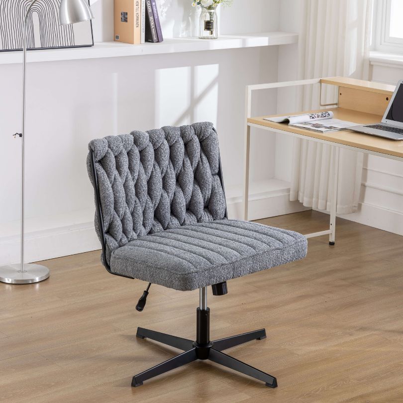 Close-up of the luxurious padded seat and backrest of the swivel office chair.