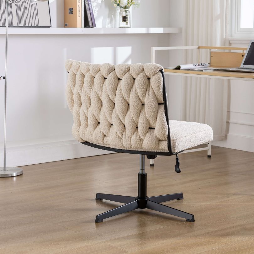 White elegant armless swivel chair in a modern office setting.