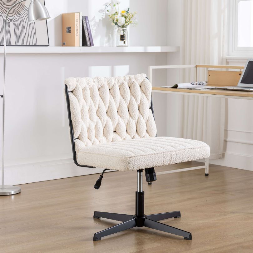 White elegant armless swivel chair in a modern office setting.