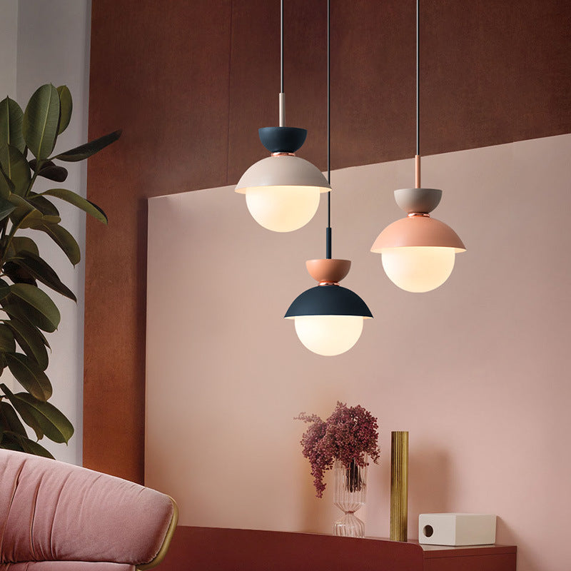 Close-up of Nordic Macaroon glass pendant light in a stylish living room setting.