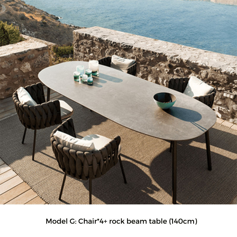 Close-up of the charcoal garden dining table with plush cushions for added comfort.