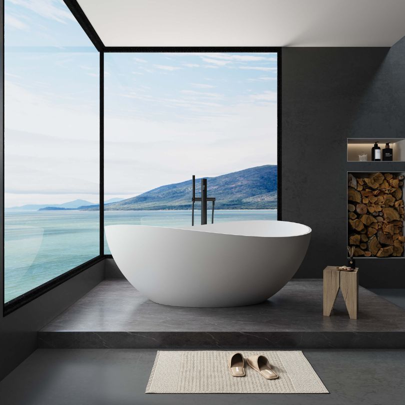 Sleek matte white freestanding bathtub in a modern bathroom setting, showcasing its elegant design and smooth finish.