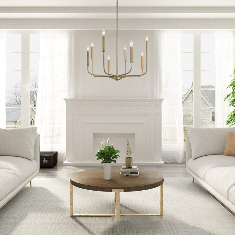 Angle view of the Rustic Elegance Brass Candle Pendant Light installed in a modern rustic living room.