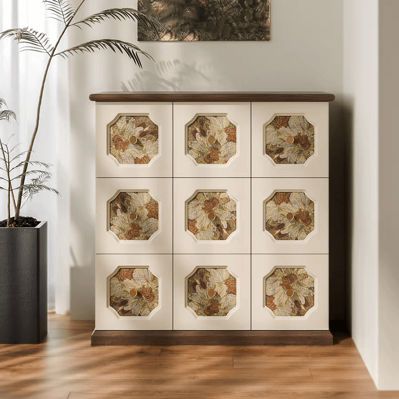 Front angle of the wooden cabinet showcasing its medieval drawer handles and white finish