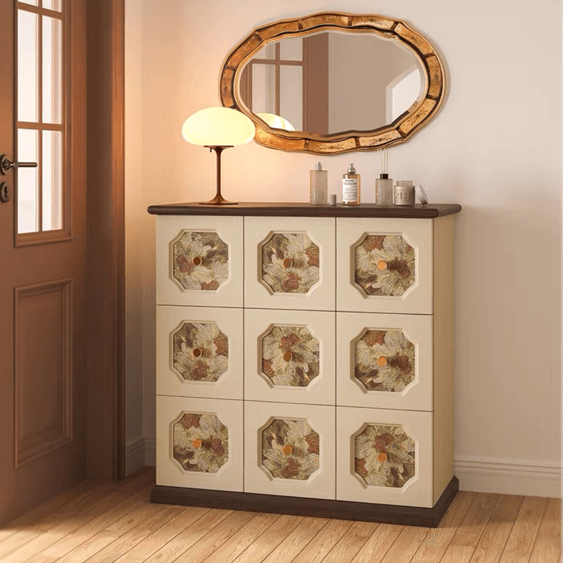 Front angle of the wooden cabinet showcasing its medieval drawer handles and white finish