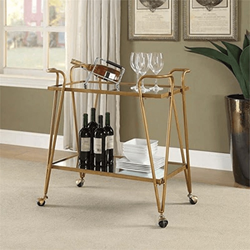 Elegant gold mirrored bar cart showcasing bottles and glasses from the top angle.