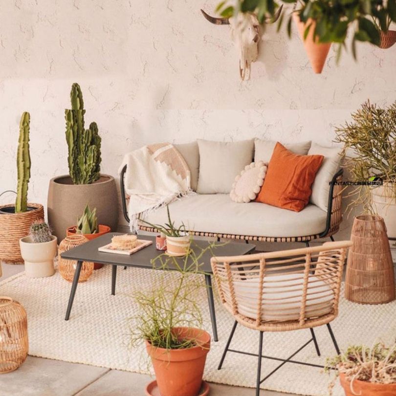 Mid-century rattan conversation set showcasing wing-back design in a sunny patio setting.